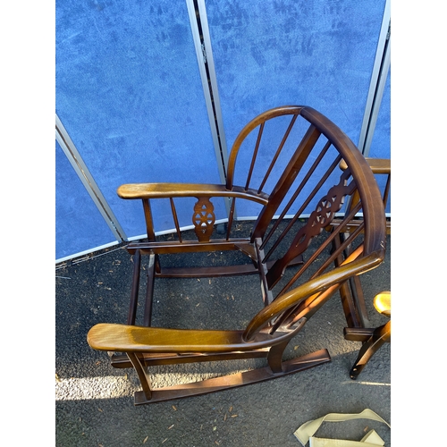 156 - A set of three wheel back arm chairs (Two are rocking chairs).

Dimensions - 26.5