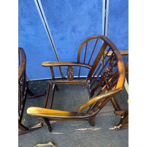 156 - A set of three wheel back arm chairs (Two are rocking chairs).

Dimensions - 26.5