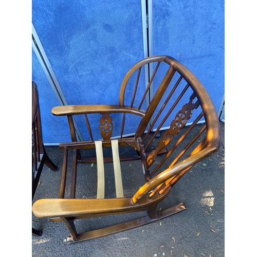 156 - A set of three wheel back arm chairs (Two are rocking chairs).

Dimensions - 26.5