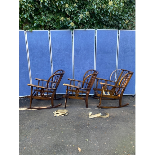 156 - A set of three wheel back arm chairs (Two are rocking chairs).

Dimensions - 26.5