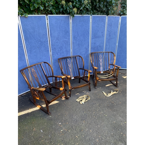 156 - A set of three wheel back arm chairs (Two are rocking chairs).

Dimensions - 26.5