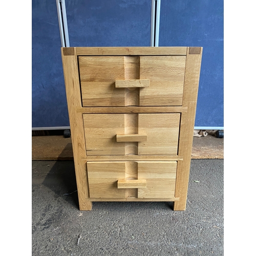 168 - John Lewis Oak bedside table with three drawers. 

Dimensions - 18