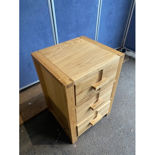 168 - John Lewis Oak bedside table with three drawers. 

Dimensions - 18