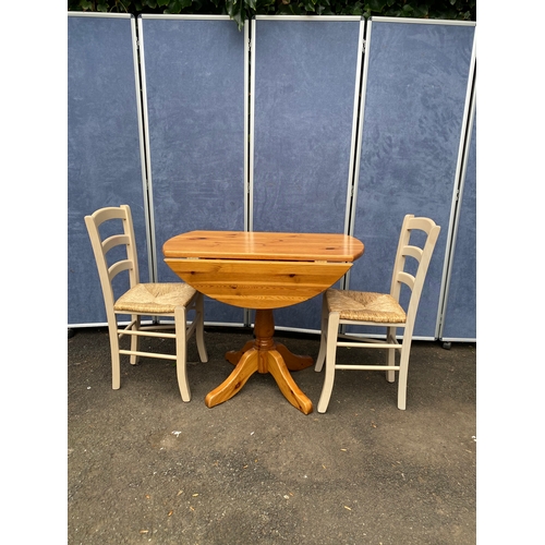 176 - Pine drop leaf table and two chairs. 

See images for all dimensions.