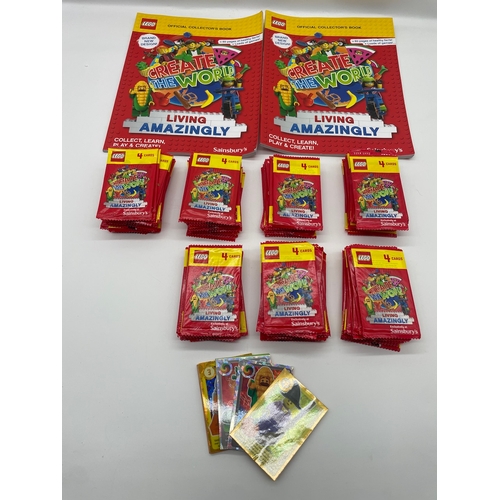 257 - Collection of Lego Create The World Collectors books + multiple unopened packs of collectors cards