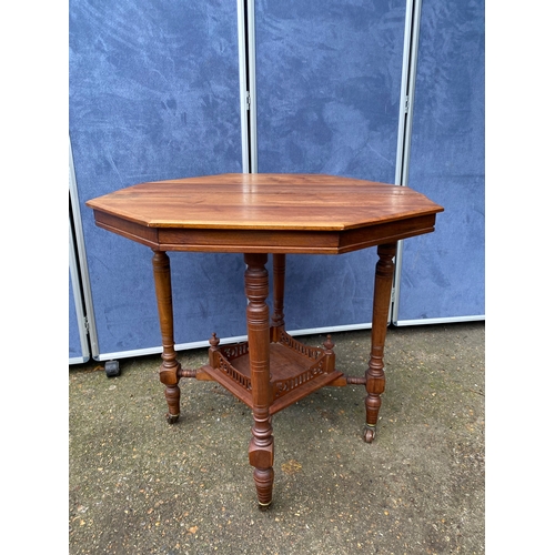 233 - Antique two tier Octagonal table on wheels. 

Dimensions - 28.5