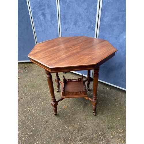 233 - Antique two tier Octagonal table on wheels. 

Dimensions - 28.5