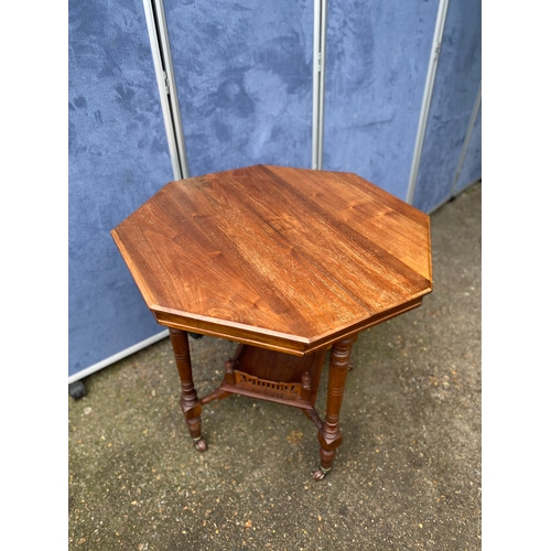 233 - Antique two tier Octagonal table on wheels. 

Dimensions - 28.5