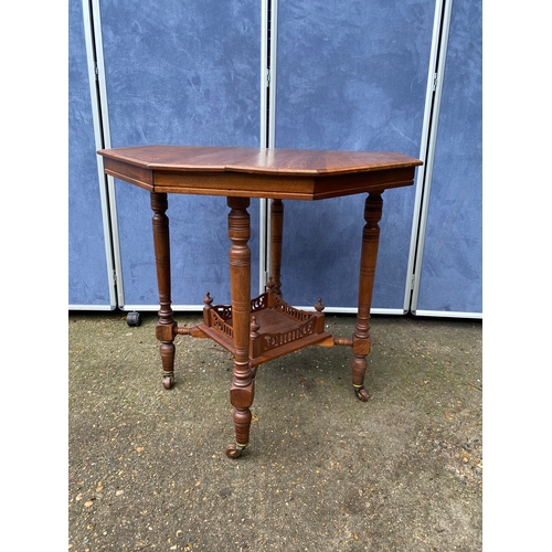 233 - Antique two tier Octagonal table on wheels. 

Dimensions - 28.5