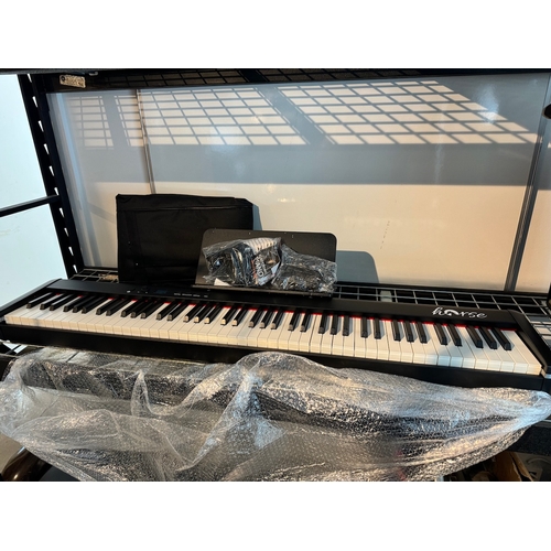 81 - Brand new Horse Electrical Piano with case