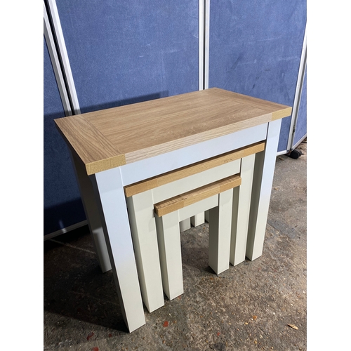 301 - Lovely modern nest of three tables. 

See images for dimensions of largest as reference.