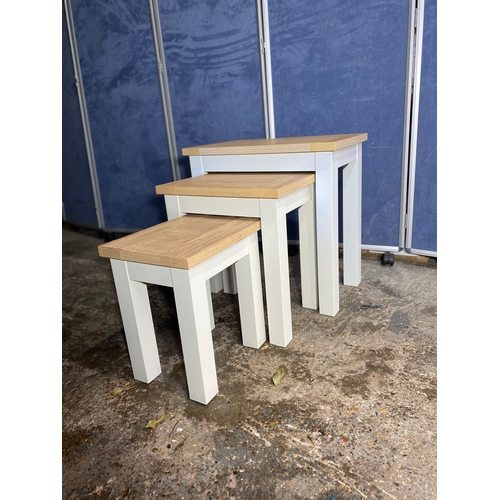 301 - Lovely modern nest of three tables. 

See images for dimensions of largest as reference.