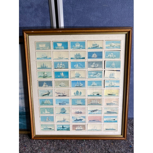 342 - A print of a boat and a collection of framed cards.