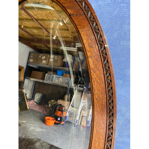 353 - Two vintage oval mirrors.