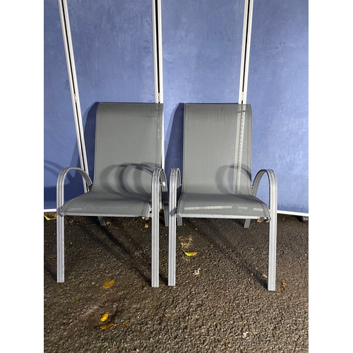 496 - A pair of metal garden chairs.