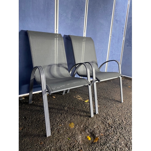 496 - A pair of metal garden chairs.