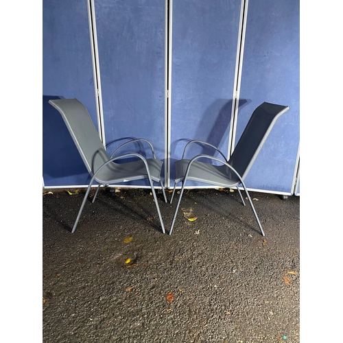 496 - A pair of metal garden chairs.