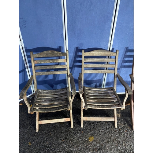 503 - A set of four Alexander rose Teak foldable garden chairs with circular Teak garden table and parasol... 