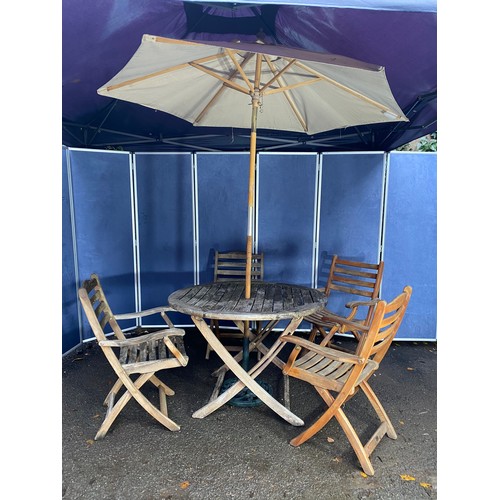 503 - A set of four Alexander rose Teak foldable garden chairs with circular Teak garden table and parasol... 