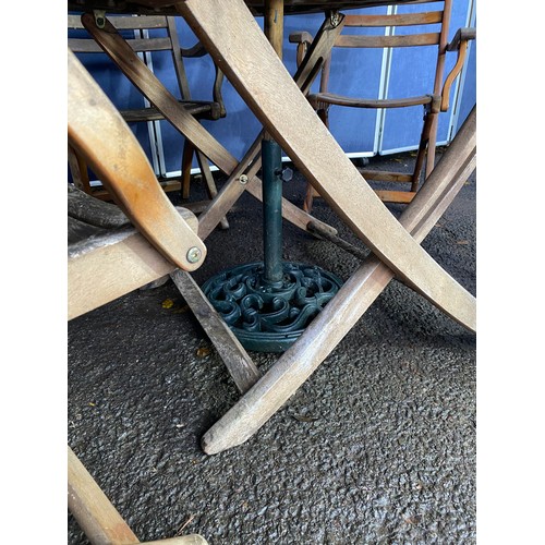 503 - A set of four Alexander rose Teak foldable garden chairs with circular Teak garden table and parasol... 