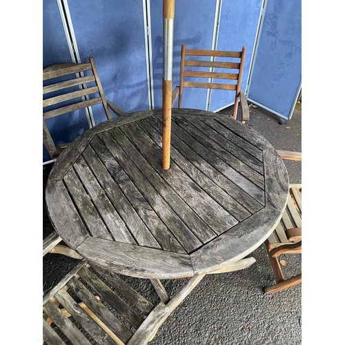 503 - A set of four Alexander rose Teak foldable garden chairs with circular Teak garden table and parasol... 