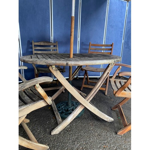 503 - A set of four Alexander rose Teak foldable garden chairs with circular Teak garden table and parasol... 