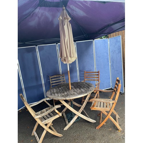 503 - A set of four Alexander rose Teak foldable garden chairs with circular Teak garden table and parasol... 