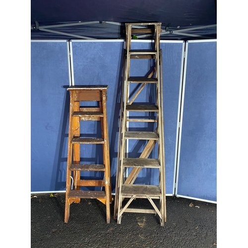 Two vintage wooden decorators ladders.