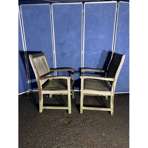 507 - A pair of Teak Indian ocean garden chairs and side table. 

Please see images for all dimensions.