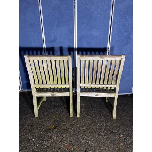 507 - A pair of Teak Indian ocean garden chairs and side table. 

Please see images for all dimensions.