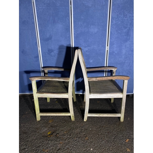 507 - A pair of Teak Indian ocean garden chairs and side table. 

Please see images for all dimensions.