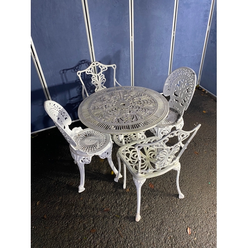 508 - Vintage White painted cast garden table and four chairs.