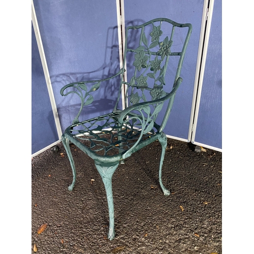 510 - Vintage cast garden side table and chair in green.