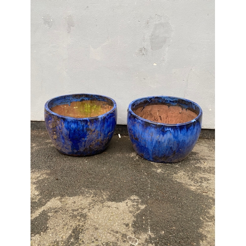 516 - A pair of large blue glazed plant pot.