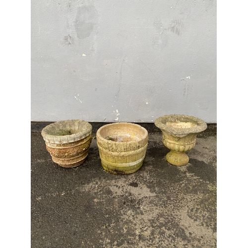 526 - A trio of vintage stone garden pots