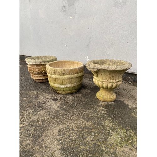 526 - A trio of vintage stone garden pots