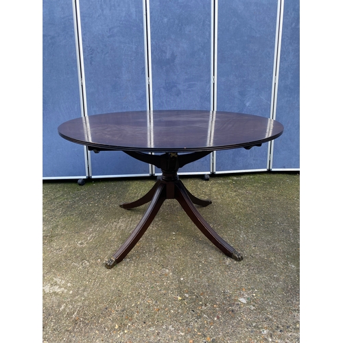 200 - Mahogany extendable dining table and four chairs.