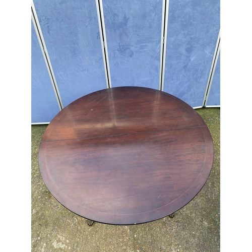 200 - Mahogany extendable dining table and four chairs.