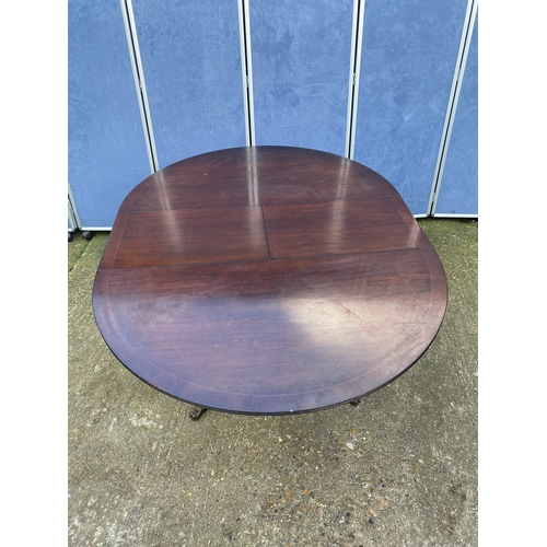 200 - Mahogany extendable dining table and four chairs.