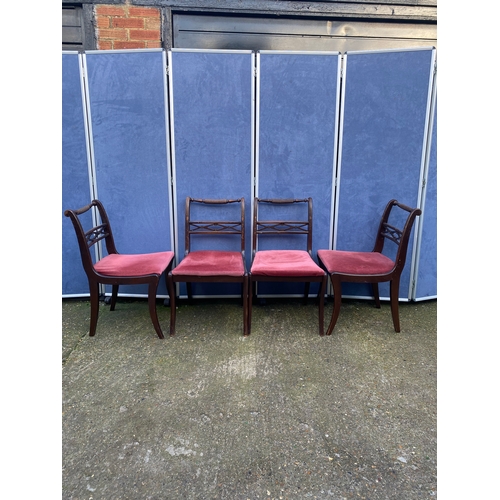 200 - Mahogany extendable dining table and four chairs.