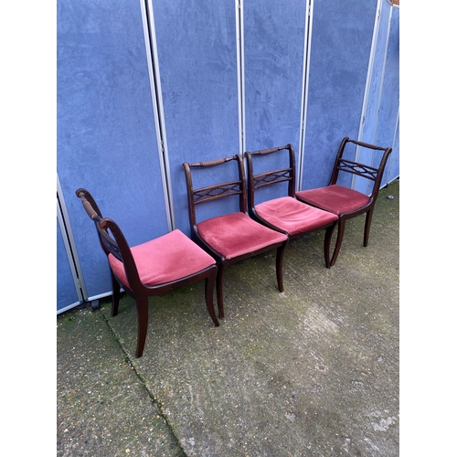 200 - Mahogany extendable dining table and four chairs.