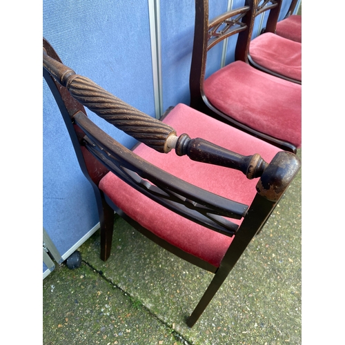 200 - Mahogany extendable dining table and four chairs.