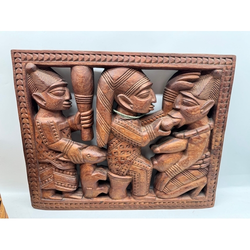 111 - Collection of items including African carved plaque, bagatelle, wooden carved pot, Eagle statue, Afr... 