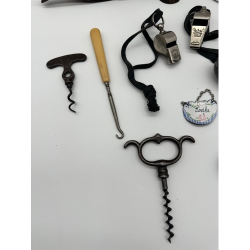 85 - Collection of vintage corkscrews, whistles, cigarette cases, display dagger + others