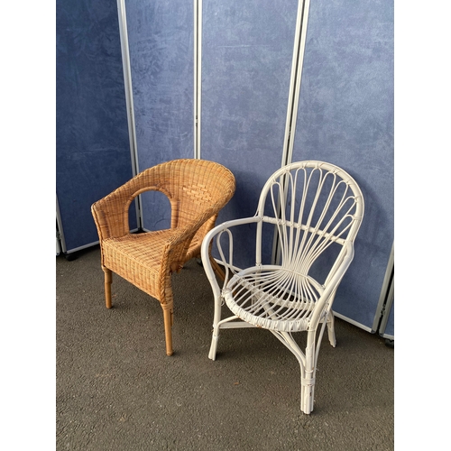 426 - Two wicker/ Cane arm chairs. 

Please see images for all dimensions.