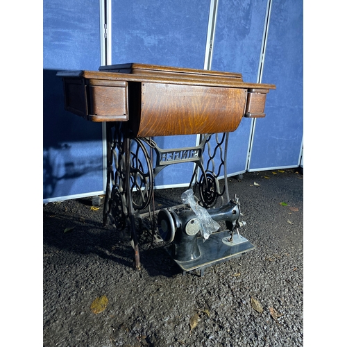 331 - Antique Singer sewing machine and table.