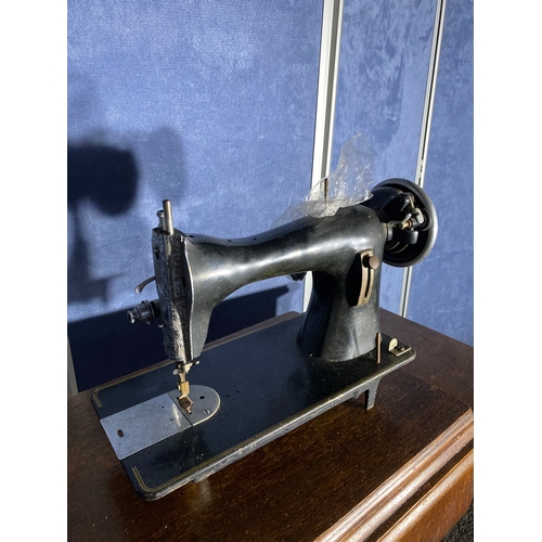 331 - Antique Singer sewing machine and table.