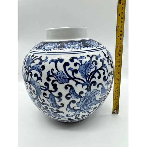 106 - 20th century blue & white oriental style ceramic bulbous vase - 35cm