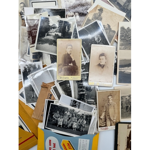 119 - Quantity of black & white family photographs with some original military photographs / postcards & 1... 