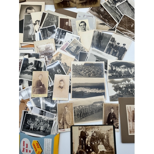 119 - Quantity of black & white family photographs with some original military photographs / postcards & 1... 